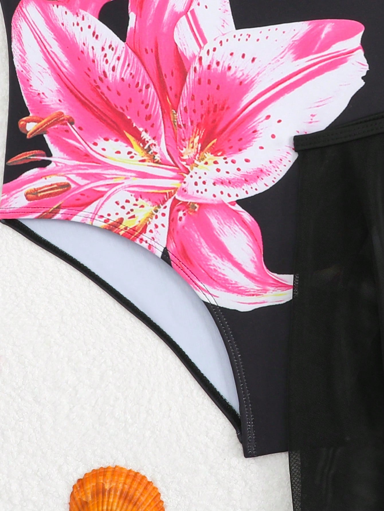 Girls floral print swimsuit set with strap neckline, sleeveless fitted top, and pleated mesh skirt bottom for beach and summer vacation wear.