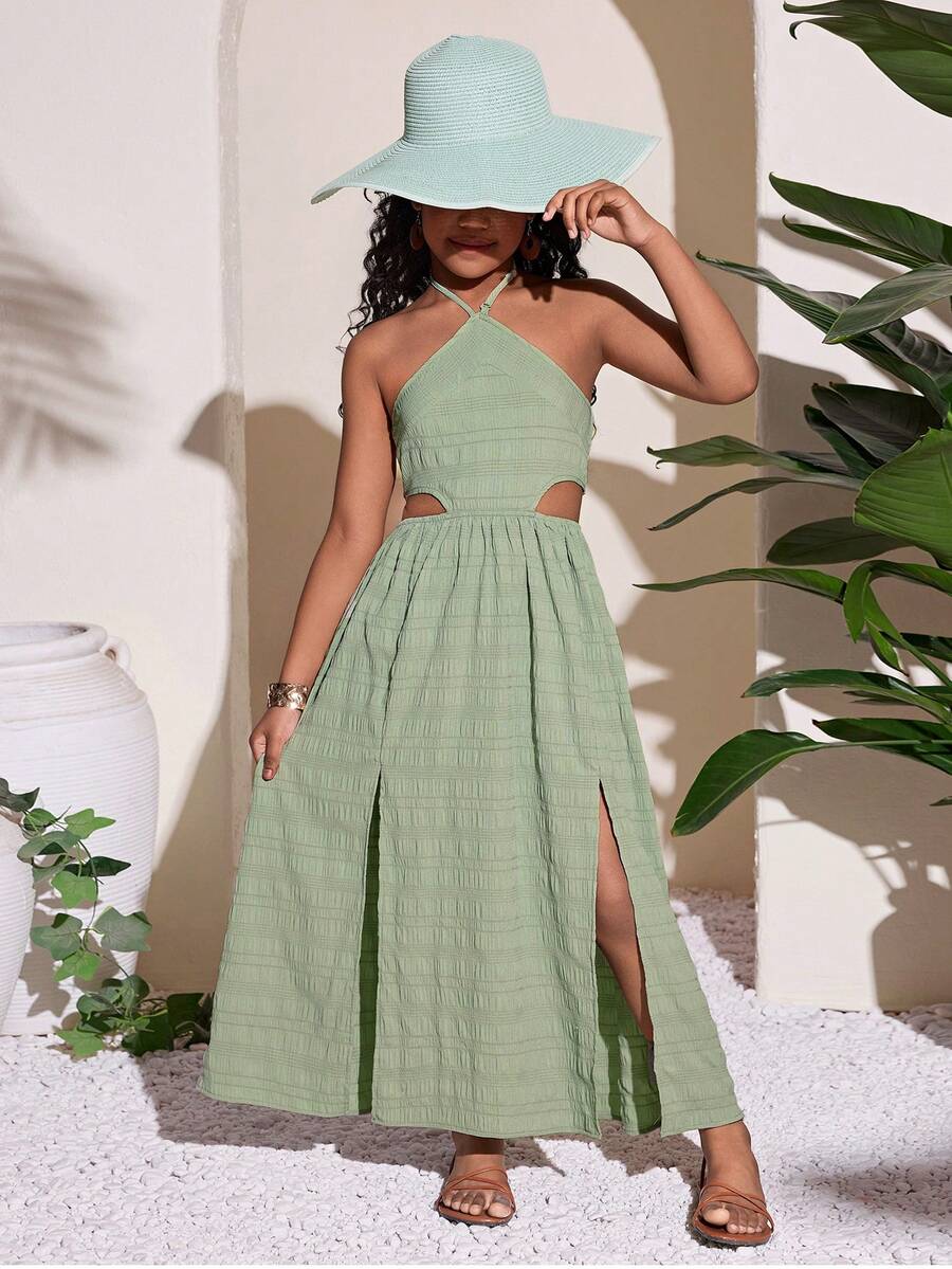 Tween girl yellow long halter dress with cutout waist, split detail, shirred textured fabric, sleeveless design, high waist, and flared hem for beach vacation wear.