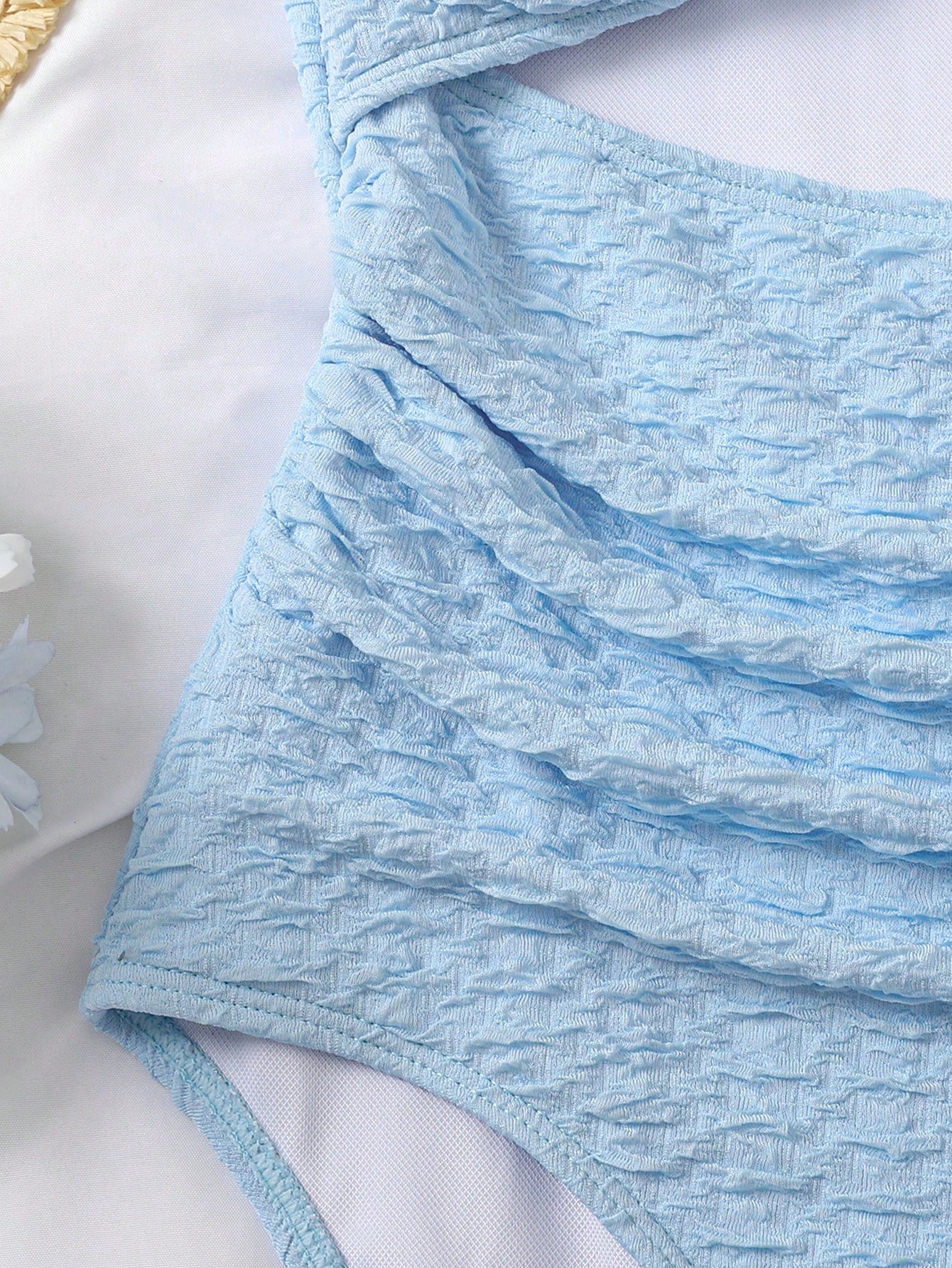 Baby blue tween girls one-piece swimsuit with textured metallic starfish decor, spaghetti straps, ruched fitted body, and short apron-style skirt cover-up