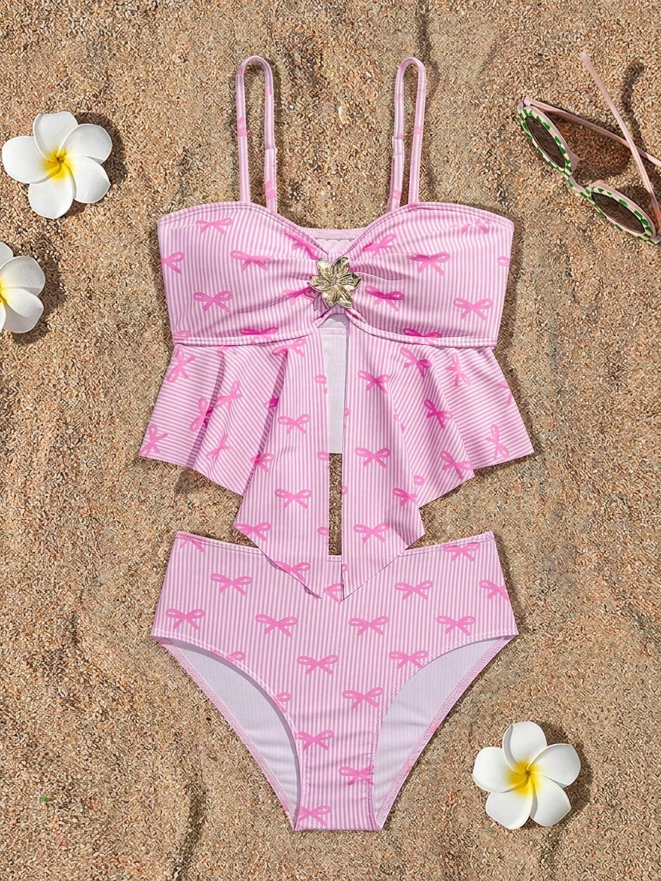 Tween girls two-piece tankini swimwear set with spaghetti straps, asymmetrical design, and 3D rose detail. Features a plant-pattern top and mid-waist bottoms in stretchy fabric for beach or pool wear.