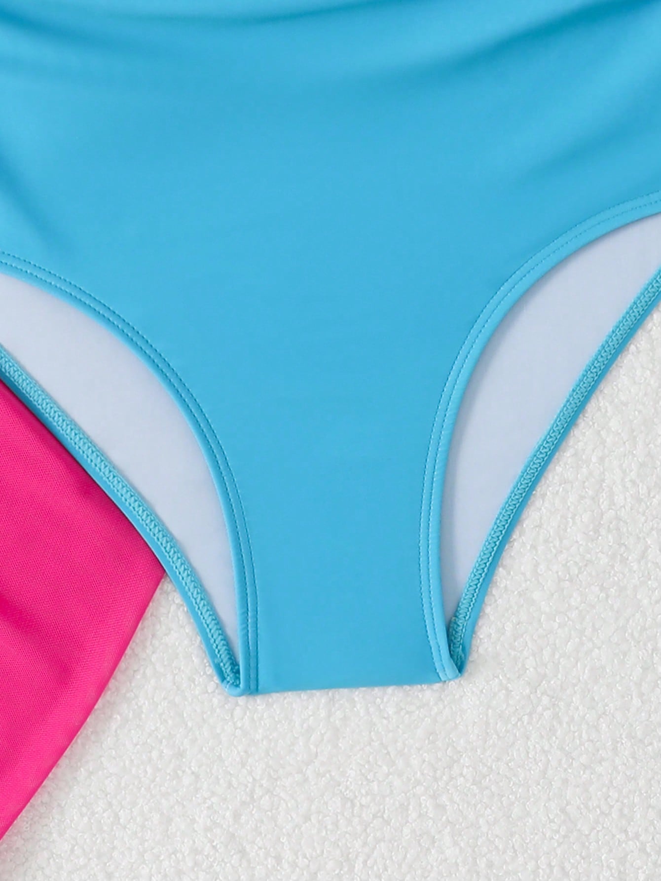 Girls black and white one-piece swimsuit set with cut-out detail, spaghetti straps, sleeveless fitted design, and matching skirt bottom for vacation swimwear.