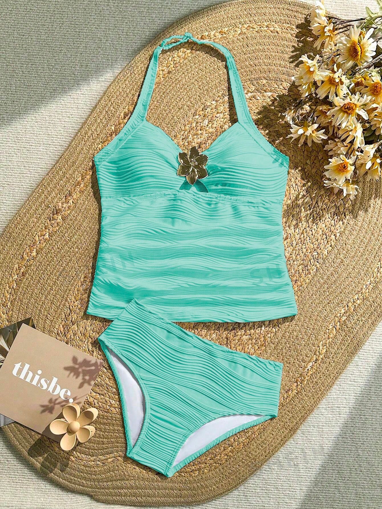 Tween girls 2-piece bikini swimwear set in black with a wave-pattern geometric design, featuring halter neckline, wireless top, and high-waist short bottoms with starfish and shell decor.