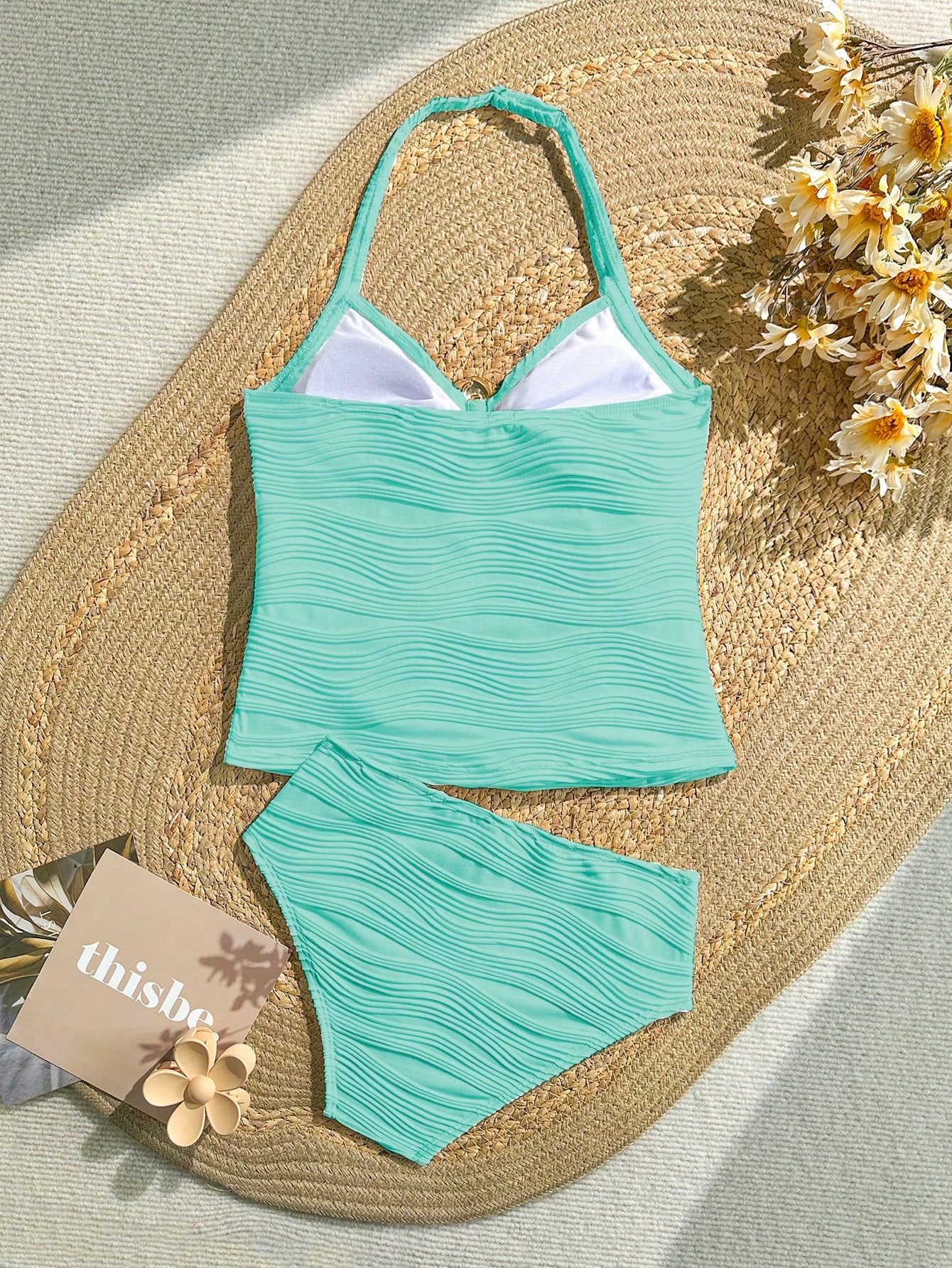 Tween girls 2-piece bikini swimwear set in black with a wave-pattern geometric design, featuring halter neckline, wireless top, and high-waist short bottoms with starfish and shell decor.