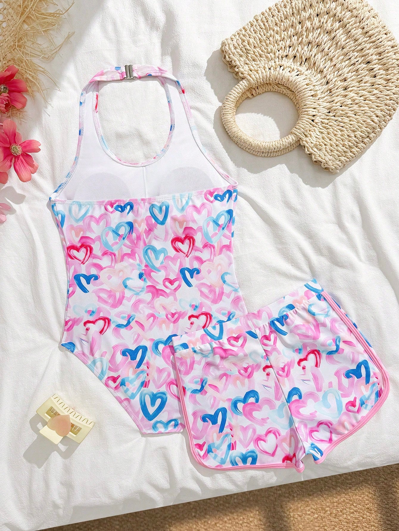 Girls 2-piece swimwear set featuring a butterfly print halter swimsuit top with contrast piping and separate mid-waist shorts; sleeveless, high-stretch, wireless design for beach and vacation wear.