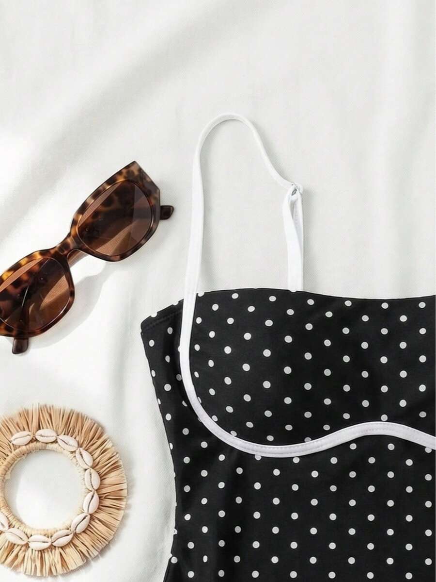 Black colorblock women's one-piece swimsuit with spaghetti straps and high stretch fabric.