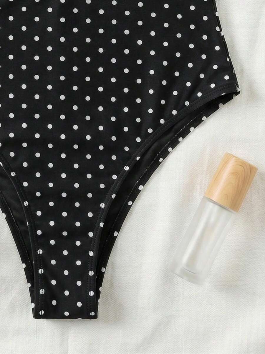 Black colorblock women's one-piece swimsuit with spaghetti straps and high stretch fabric.