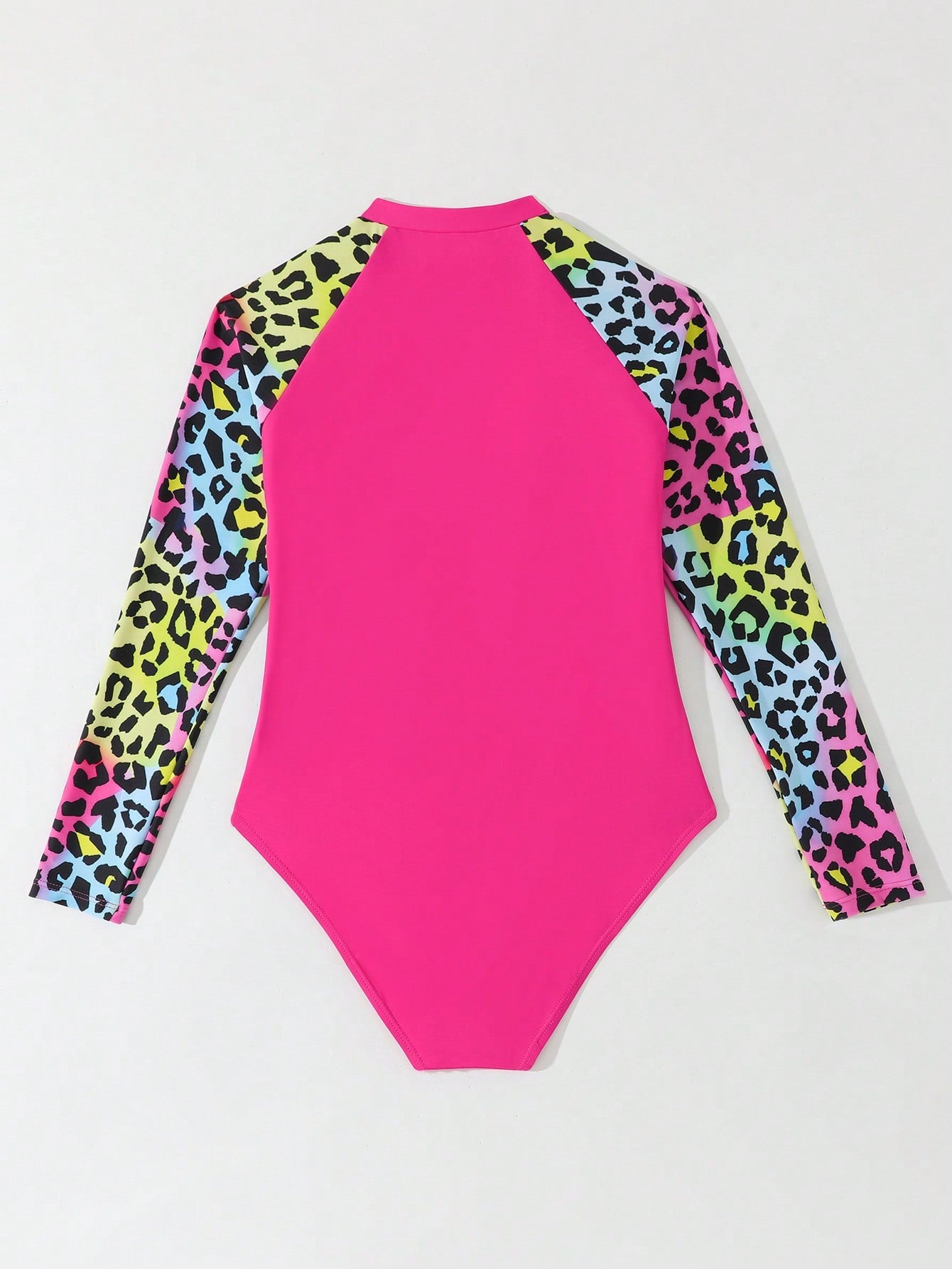 Girls one-piece swimsuit in blue with all-over leopard leaf print, ruffle detail, zipper front, high neck, and lined body for swimming and vacation.