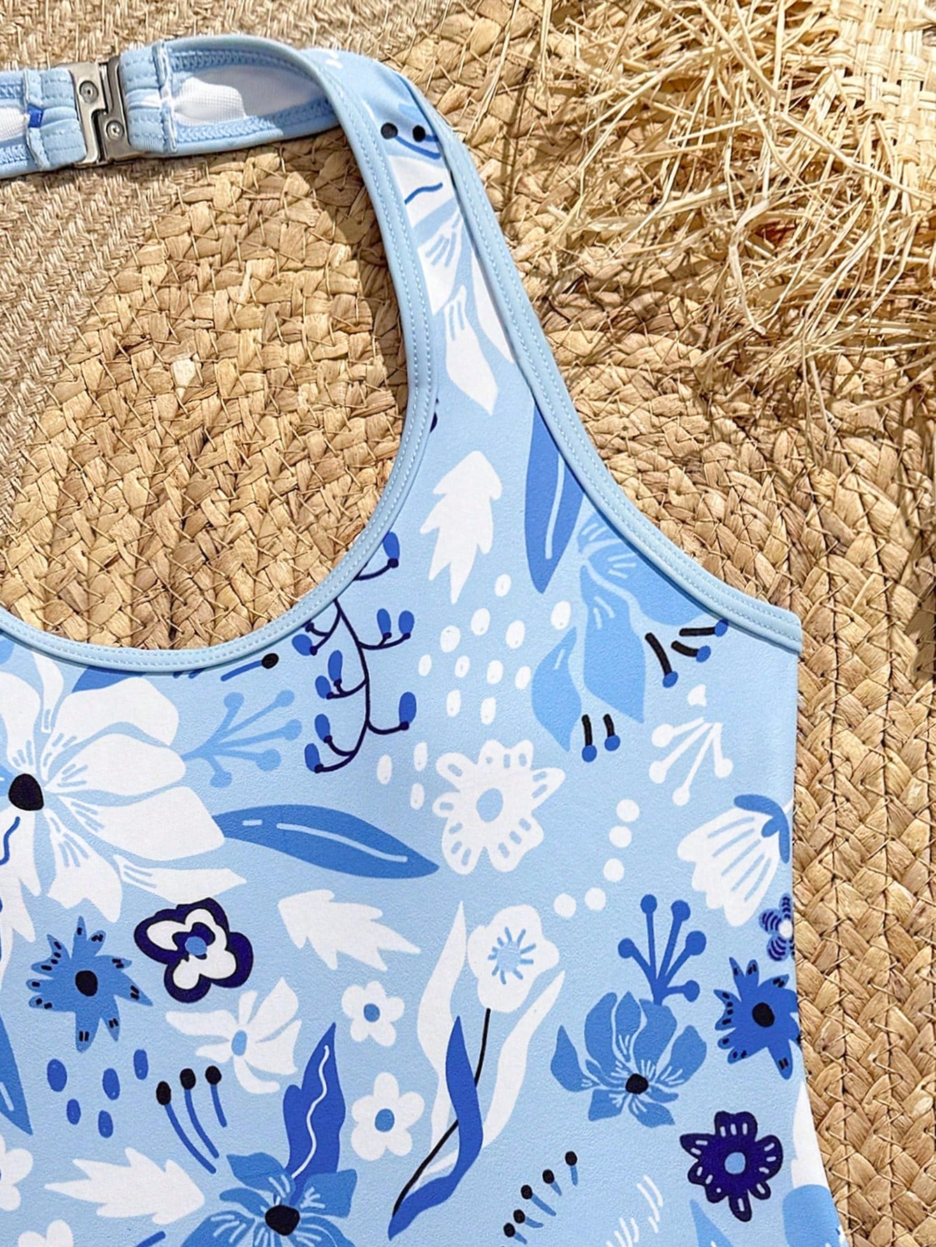 Girls 2-piece swimwear set featuring a butterfly print halter swimsuit top with contrast piping and separate mid-waist shorts; sleeveless, high-stretch, wireless design for beach and vacation wear.