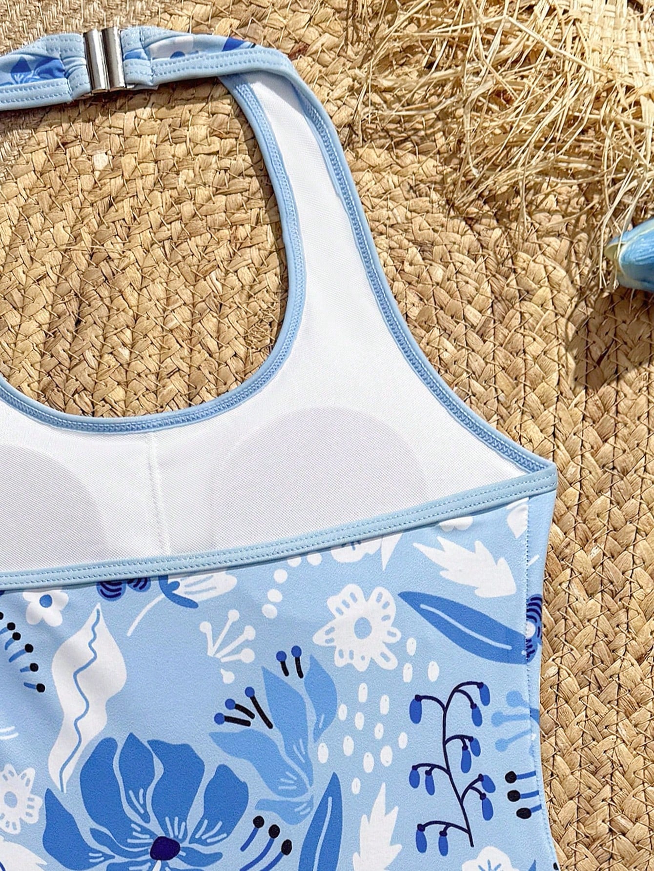 Girls 2-piece swimwear set featuring a butterfly print halter swimsuit top with contrast piping and separate mid-waist shorts; sleeveless, high-stretch, wireless design for beach and vacation wear.