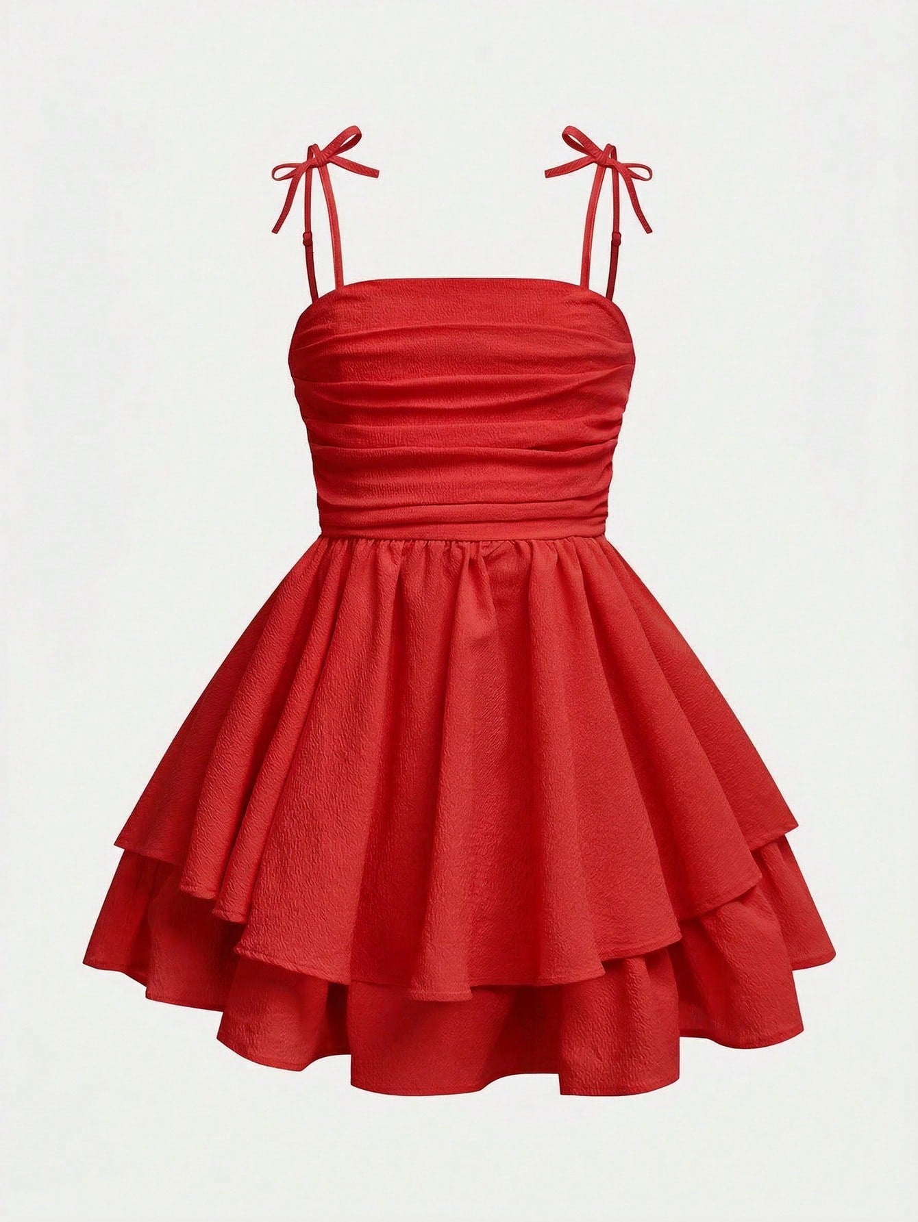 Tween girls apricot tiered cami dress with spaghetti straps, high waist, and slim fit layered hem.