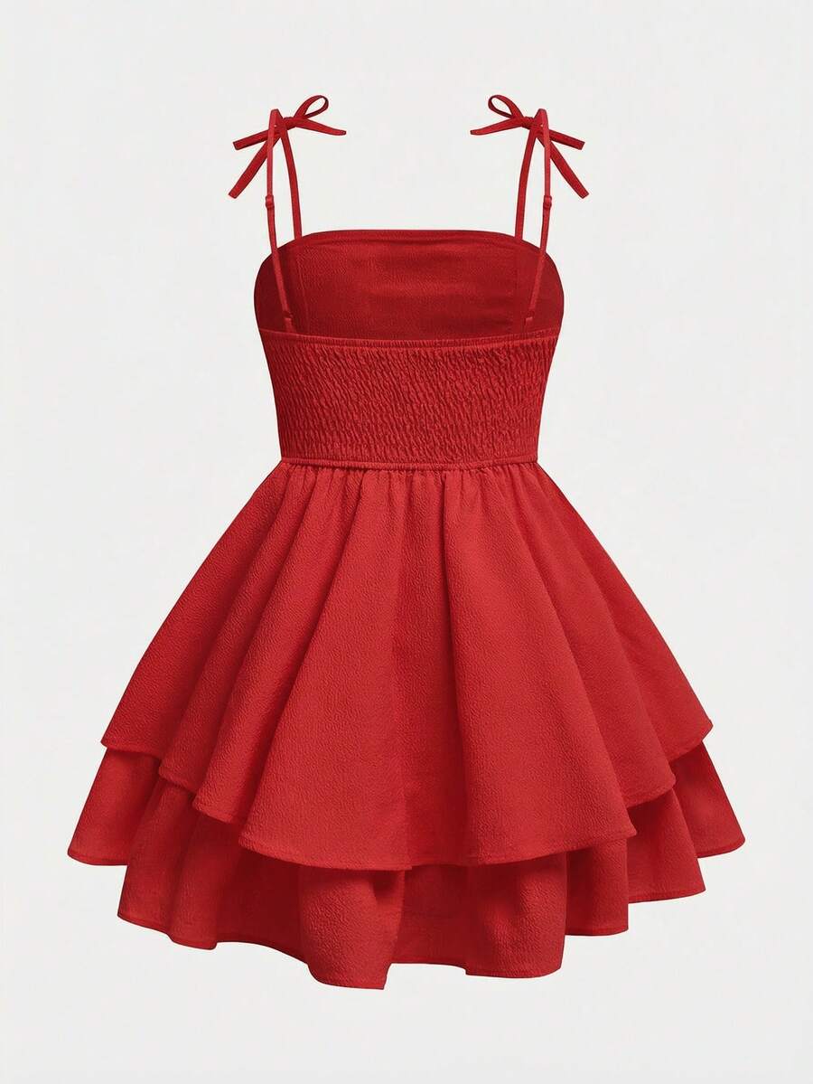 Tween girls apricot tiered cami dress with spaghetti straps, high waist, and slim fit layered hem.
