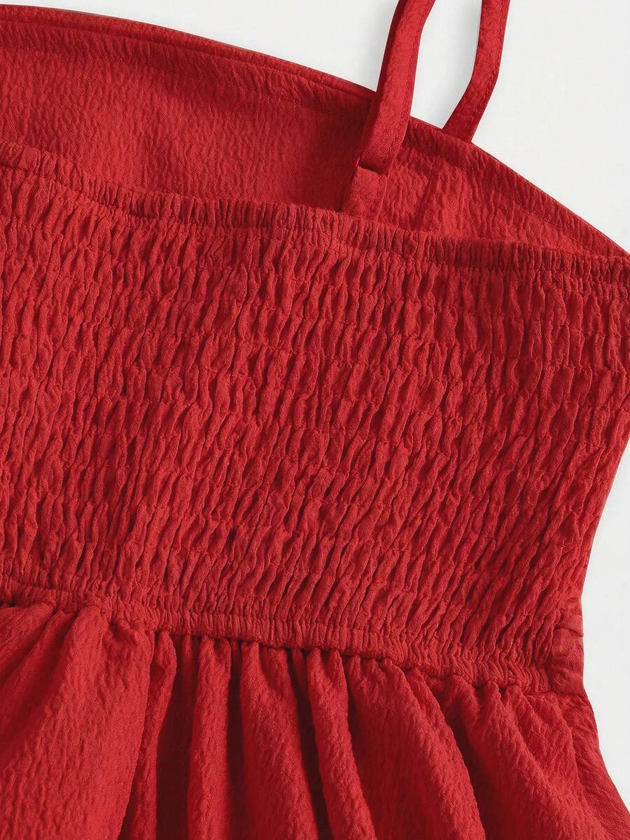 Tween girls apricot tiered cami dress with spaghetti straps, high waist, and slim fit layered hem.