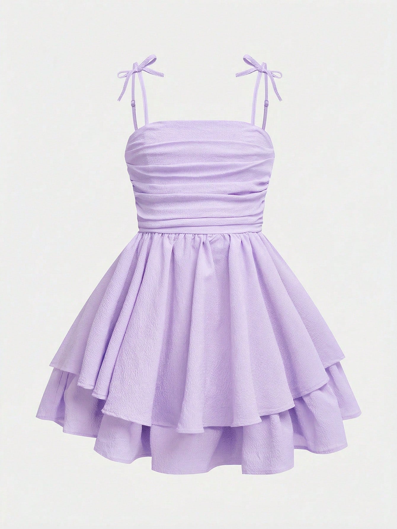 Tween girls apricot tiered cami dress with spaghetti straps, high waist, and slim fit layered hem.