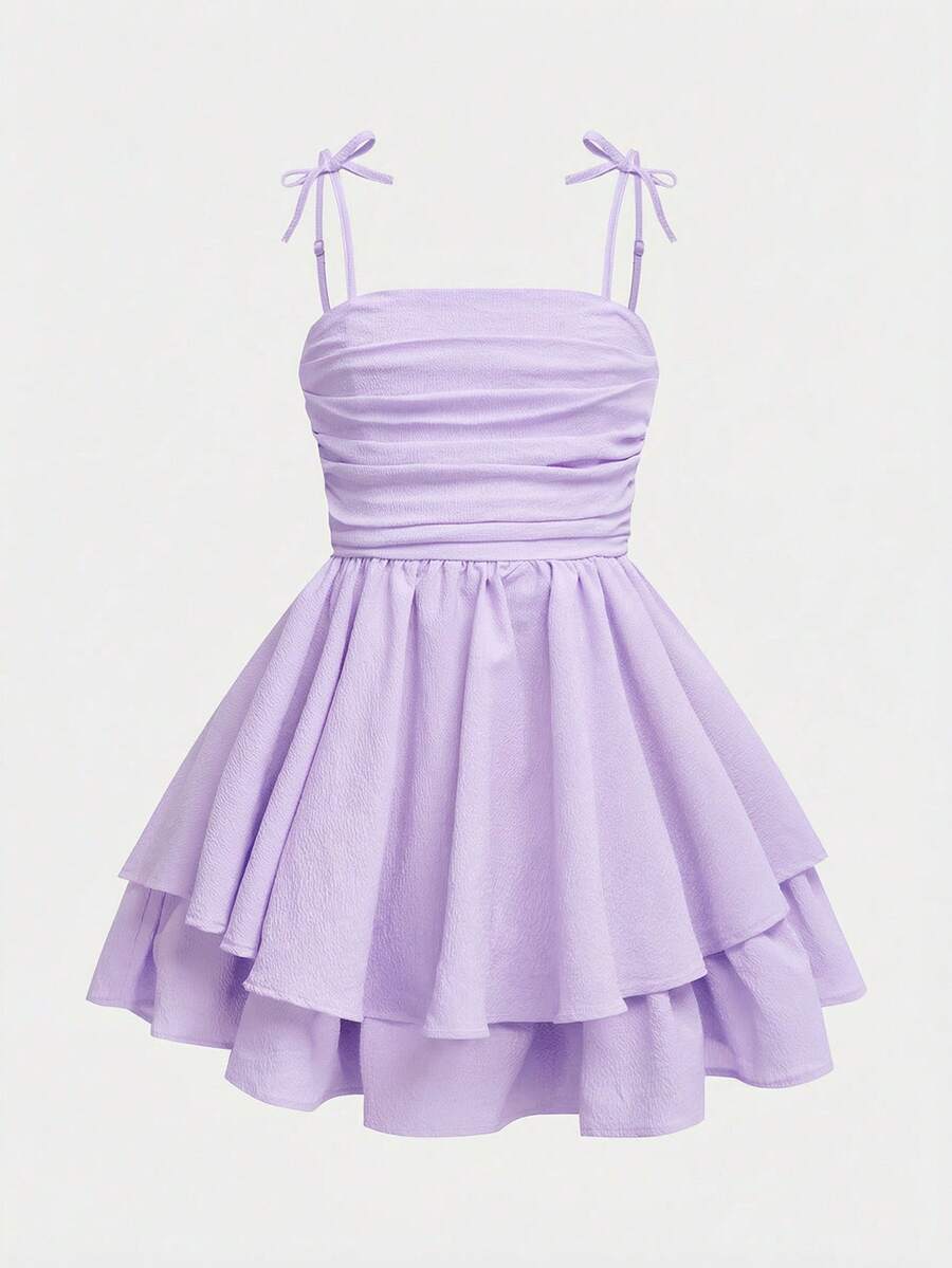 Tween girls apricot tiered cami dress with spaghetti straps, high waist, and slim fit layered hem.