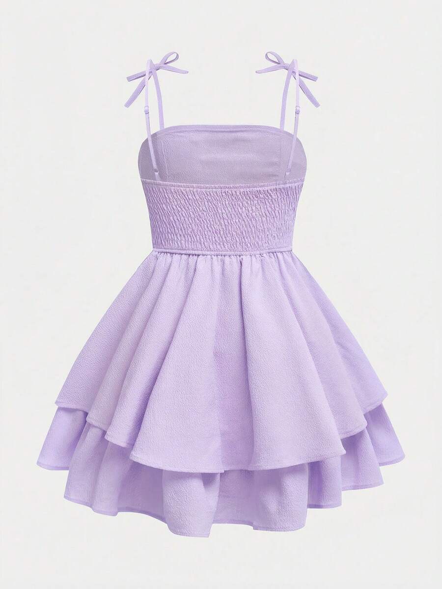 Tween girls apricot tiered cami dress with spaghetti straps, high waist, and slim fit layered hem.