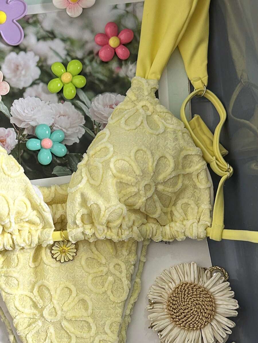 Women's 2-piece triangle cup bikini set in solid color featuring woven pearl shell decoration, halter neckline, and high-waist side-tie ruched bottoms.