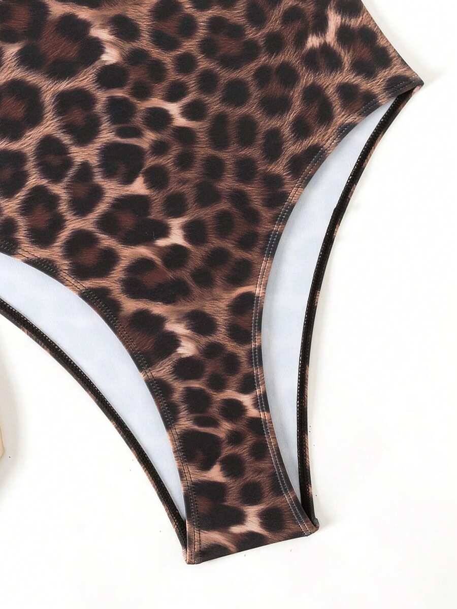 Women's solid color one-piece swimsuit featuring a backless scoop neck design and high cut fit