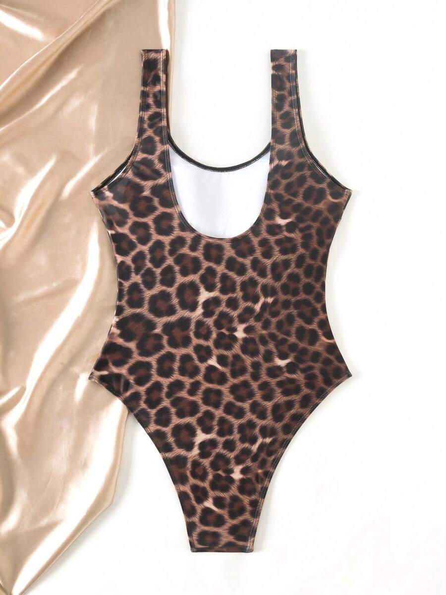 Women's solid color one-piece swimsuit featuring a backless scoop neck design and high cut fit