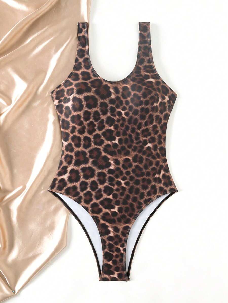 Women's solid color one-piece swimsuit featuring a backless scoop neck design and high cut fit