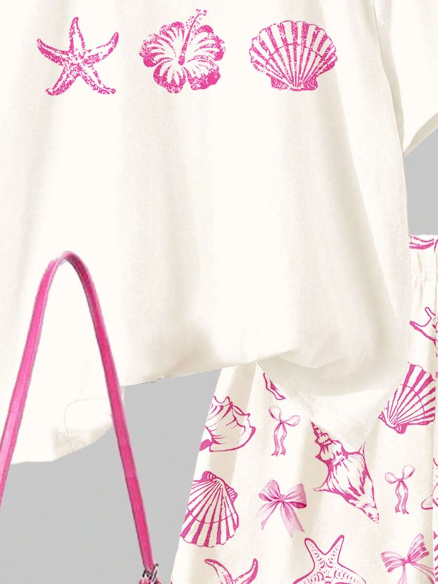 Tween girls 2-piece summer casual outfit featuring a multicolor seashell print short sleeve T-shirt with drop shoulders and matching loose fit shorts with pockets.