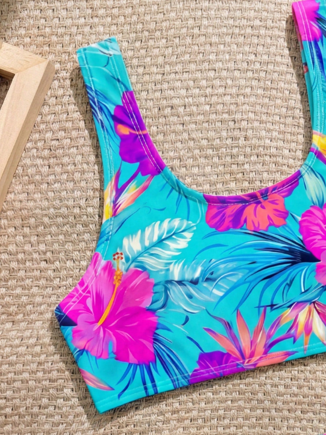 Tween girls 2-piece ditsy floral bikini set featuring a spaghetti strap top with center string detail and matching bottoms with side strings, designed for swimming, vacation, and summer wear.