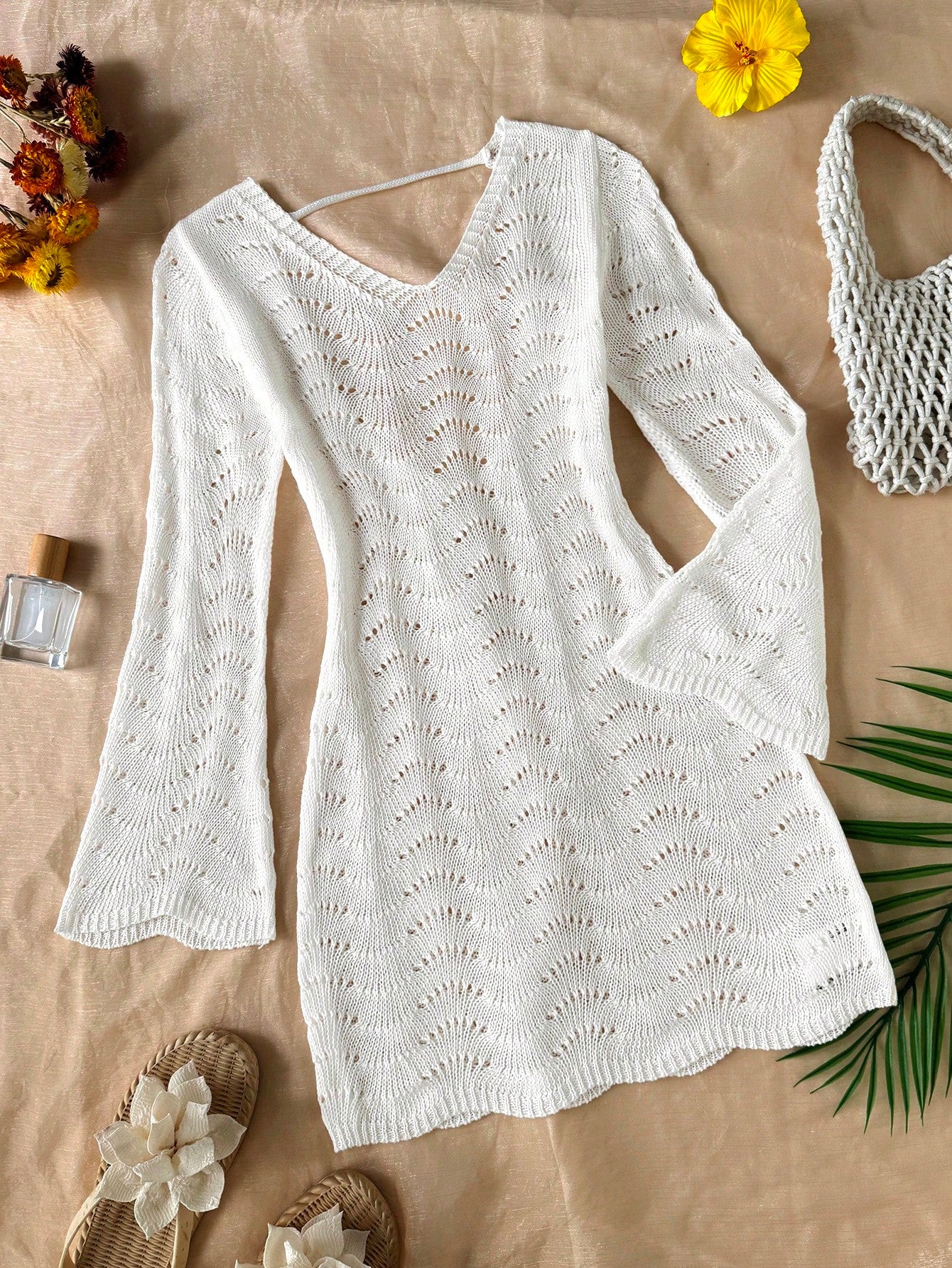 Girls semi-sheer beach cover-up dress with V-neckline, long sleeves, backless side-tie design, and asymmetrical hem for tween summer beach vacations.