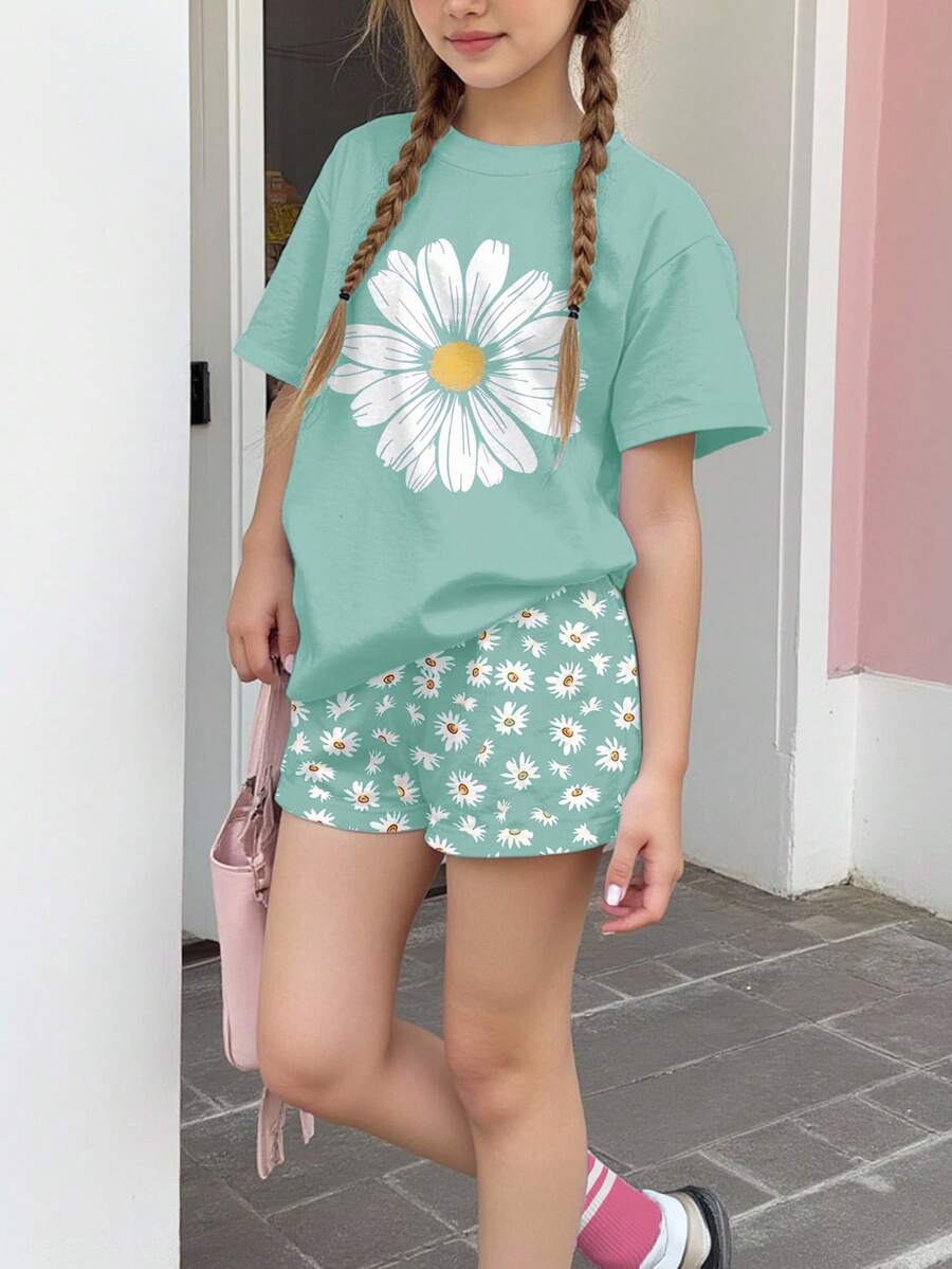 Tween girls 2-piece summer casual outfit featuring a multicolor seashell print short sleeve T-shirt with drop shoulders and matching loose fit shorts with pockets.