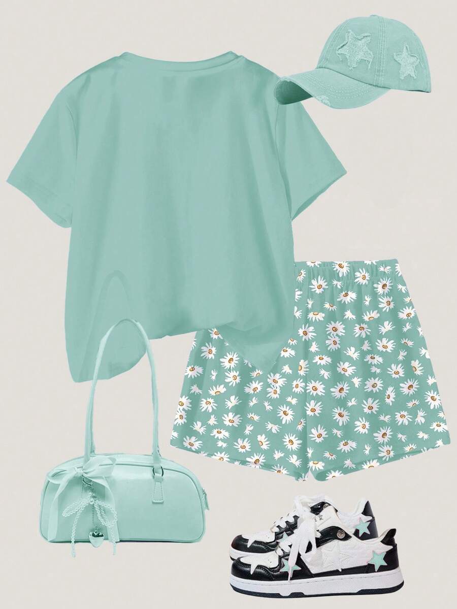 Tween girls 2-piece summer casual outfit featuring a multicolor seashell print short sleeve T-shirt with drop shoulders and matching loose fit shorts with pockets.