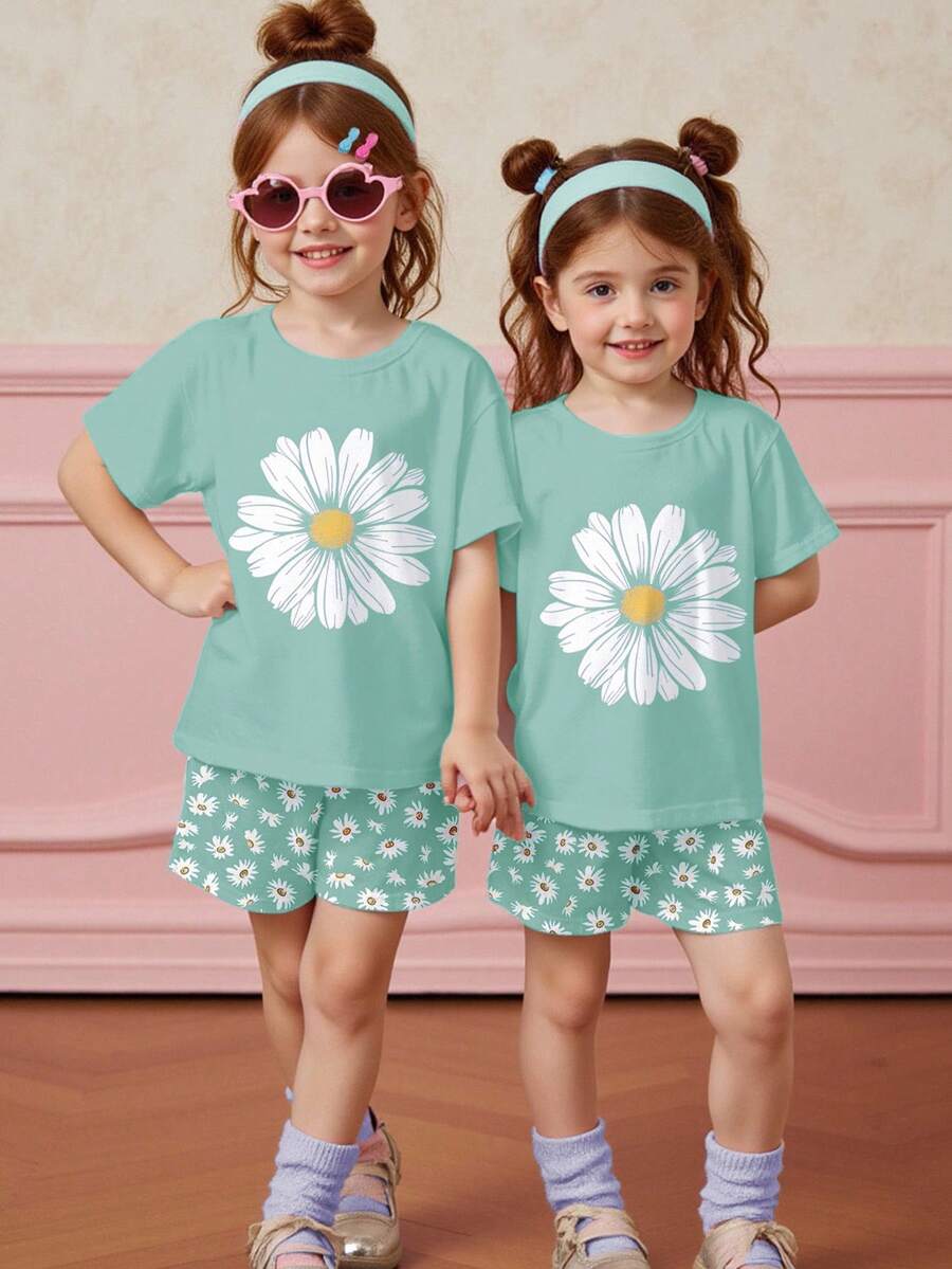 Tween girls 2-piece summer casual outfit featuring a multicolor seashell print short sleeve T-shirt with drop shoulders and matching loose fit shorts with pockets.