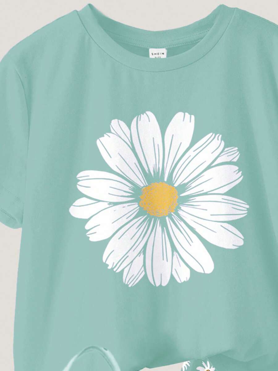 Tween girls 2-piece summer casual outfit featuring a multicolor seashell print short sleeve T-shirt with drop shoulders and matching loose fit shorts with pockets.