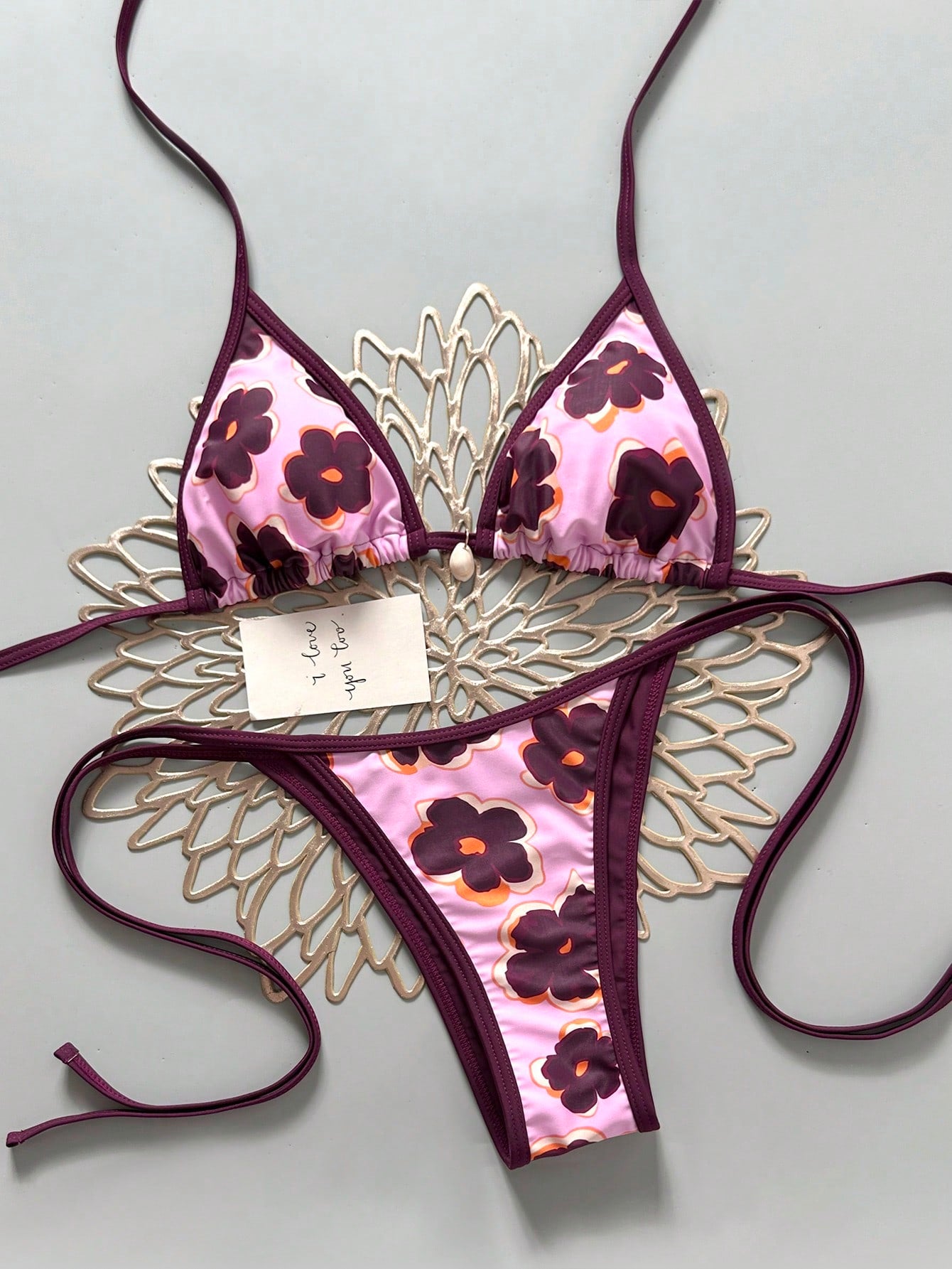 Apricot 2-piece bikini swimwear set featuring a textured halter triangle cup top with knot details and matching tie-side bottoms for women.