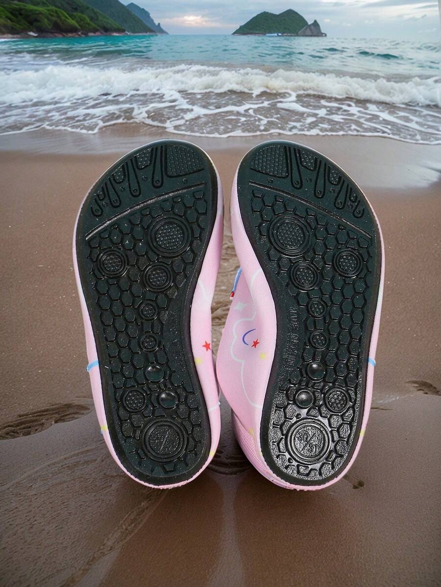 Pink slip-on elastic water shoes for girls featuring a cartoon pattern and non-slip TPR outsole.