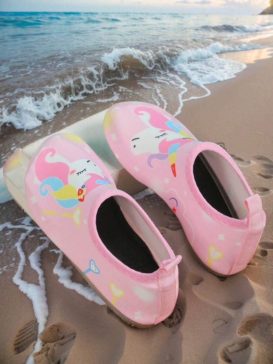 Pink slip-on elastic water shoes for girls featuring a cartoon pattern and non-slip TPR outsole.