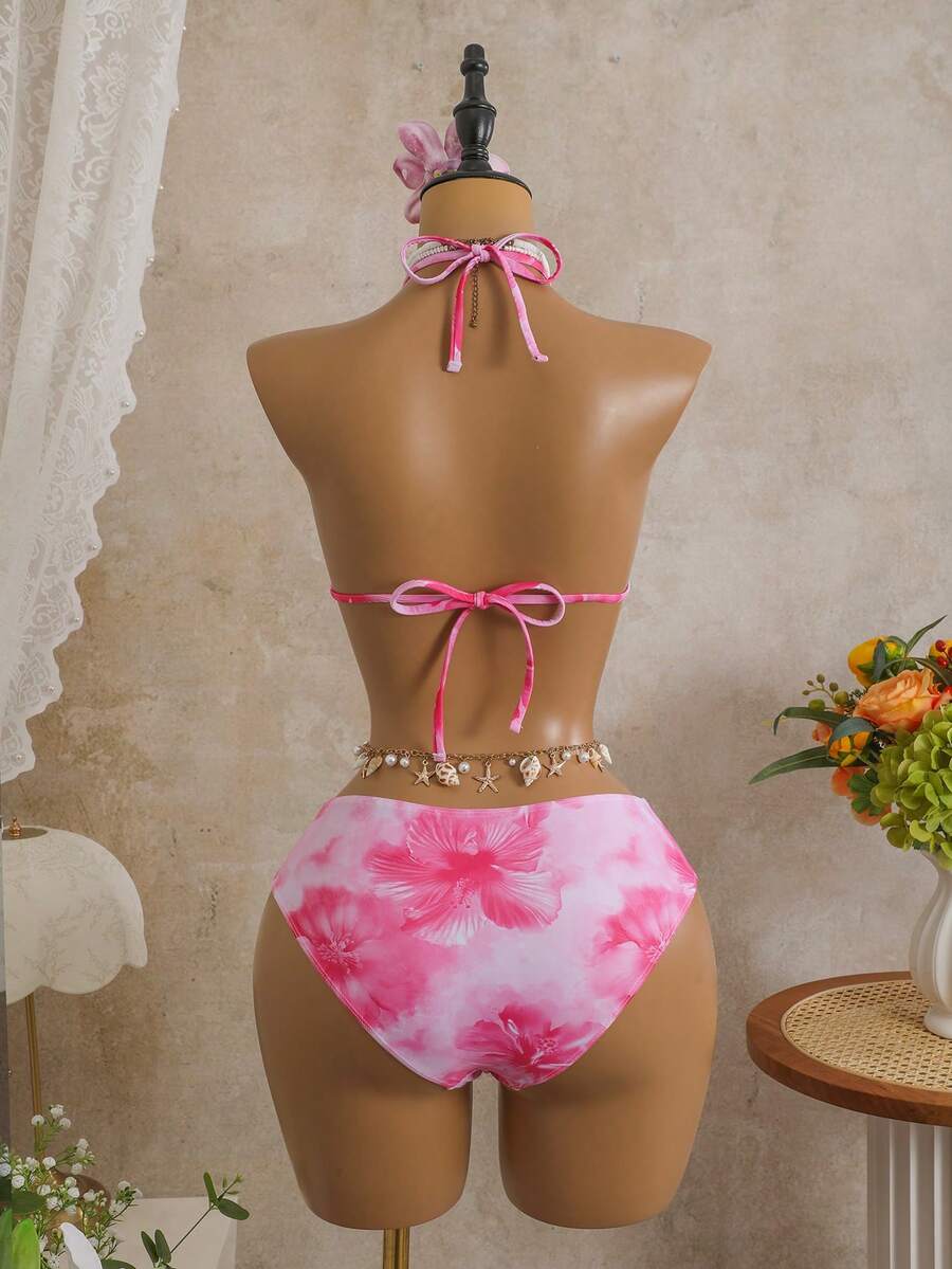 Women's black 3-piece bikini set featuring a halter triangle top with removable padding, high-waisted bottoms, and a knee-length mesh skirt with tie details.