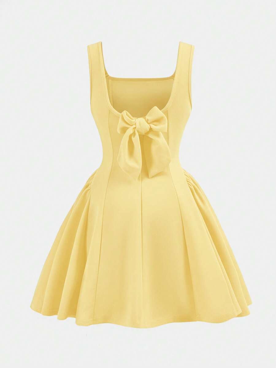 Apricot short-sleeve holiday party dress for tween girls featuring a square neckline, contrast lace details, high waist, flared A-line hem, and bowknot ruffle back detail.