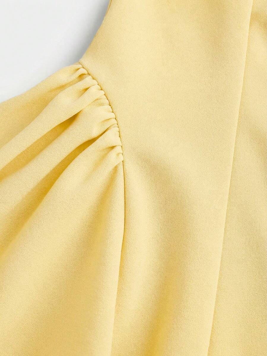 Apricot short-sleeve holiday party dress for tween girls featuring a square neckline, contrast lace details, high waist, flared A-line hem, and bowknot ruffle back detail.