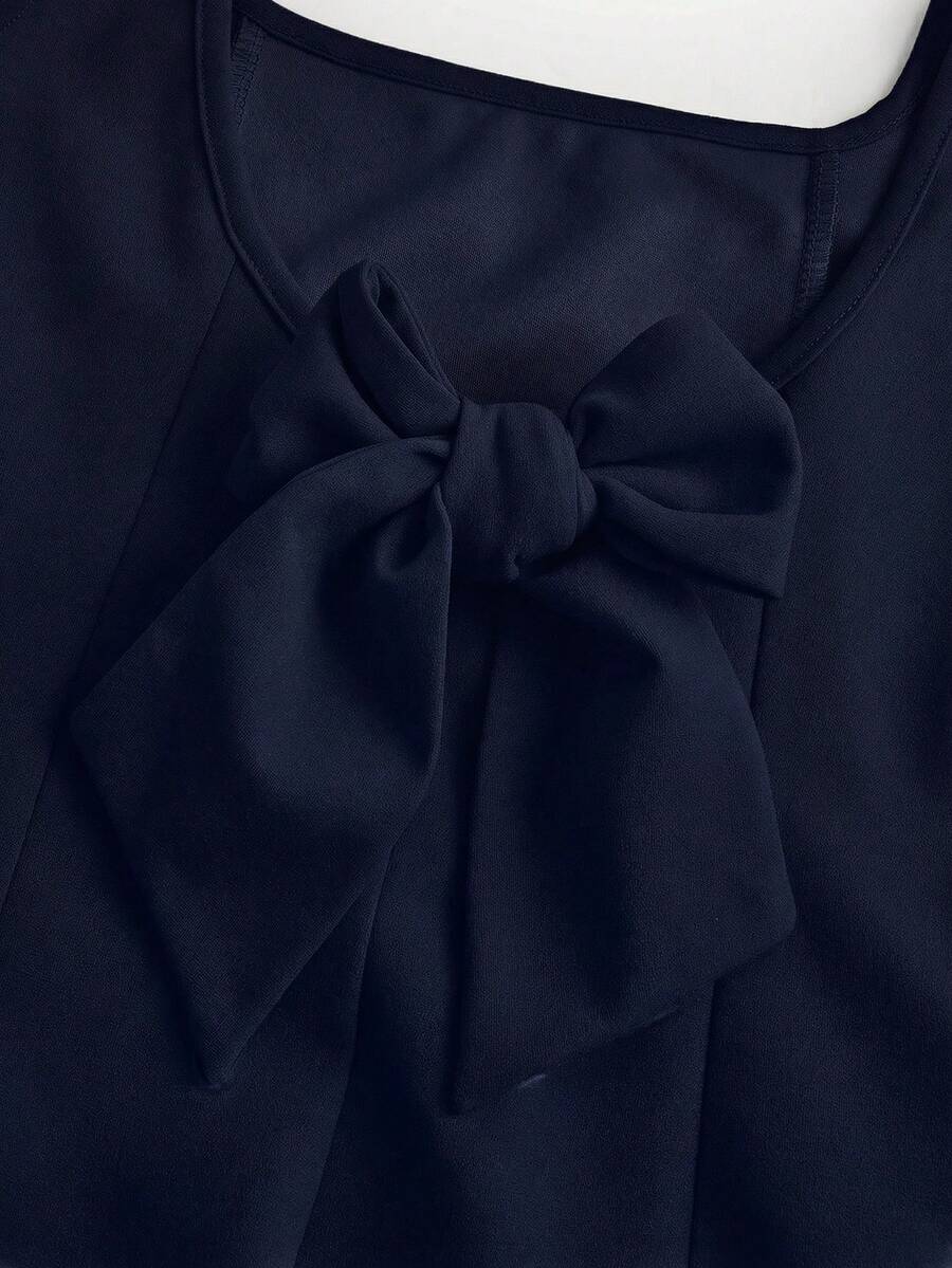 Apricot short-sleeve holiday party dress for tween girls featuring a square neckline, contrast lace details, high waist, flared A-line hem, and bowknot ruffle back detail.