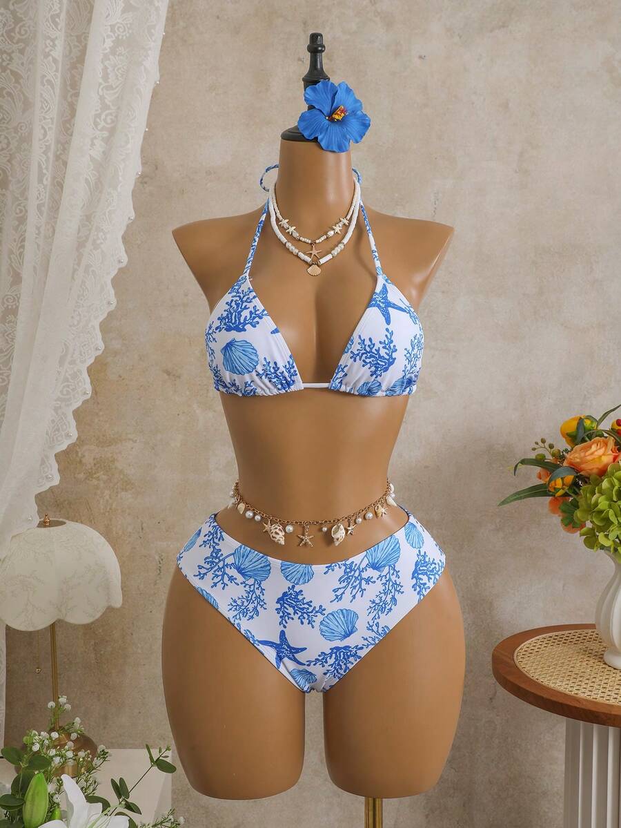 Women's black 3-piece bikini set featuring a halter triangle top with removable padding, high-waisted bottoms, and a knee-length mesh skirt with tie details.