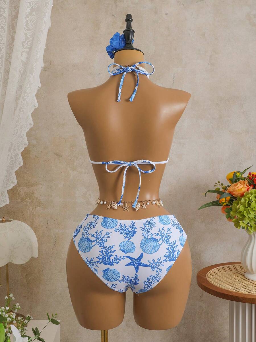 Women's black 3-piece bikini set featuring a halter triangle top with removable padding, high-waisted bottoms, and a knee-length mesh skirt with tie details.