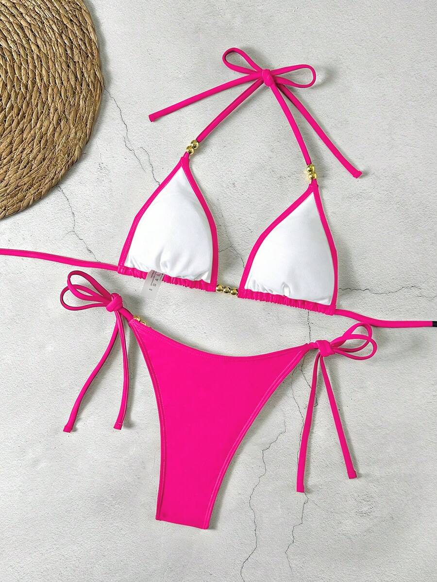 Women's black halter bikini set featuring triangle cups with gold bead decor and tie-back closure