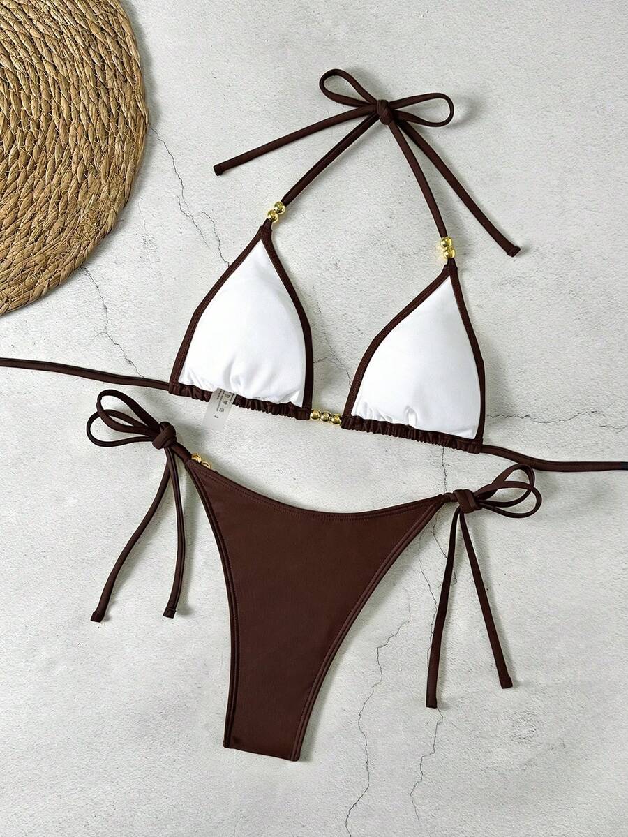 Women's black halter bikini set featuring triangle cups with gold bead decor and tie-back closure