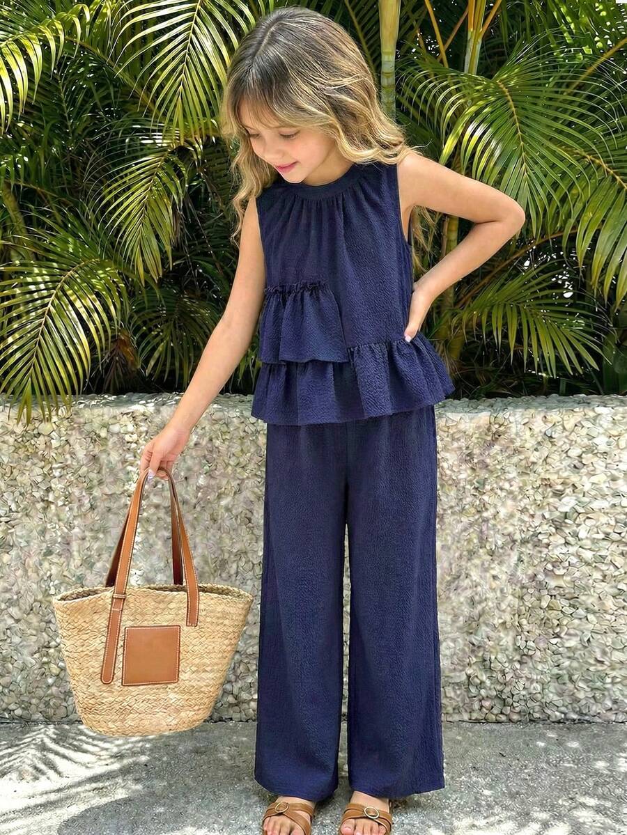 Tween girls blue striped sleeveless short top with button and ruffle details paired with matching long straight leg pants.