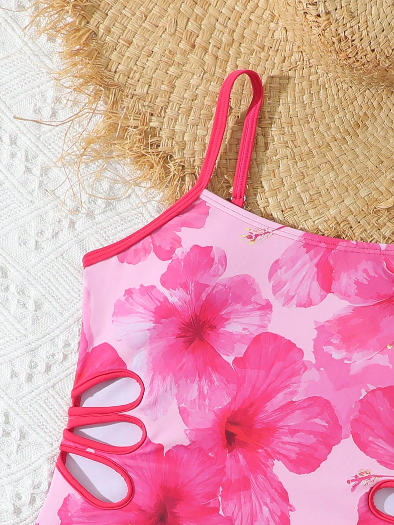 Tween girls black two-piece tankini swimwear set featuring a spaghetti strap sleeveless top with cutout detail and contrast piping, paired with short swim shorts.
