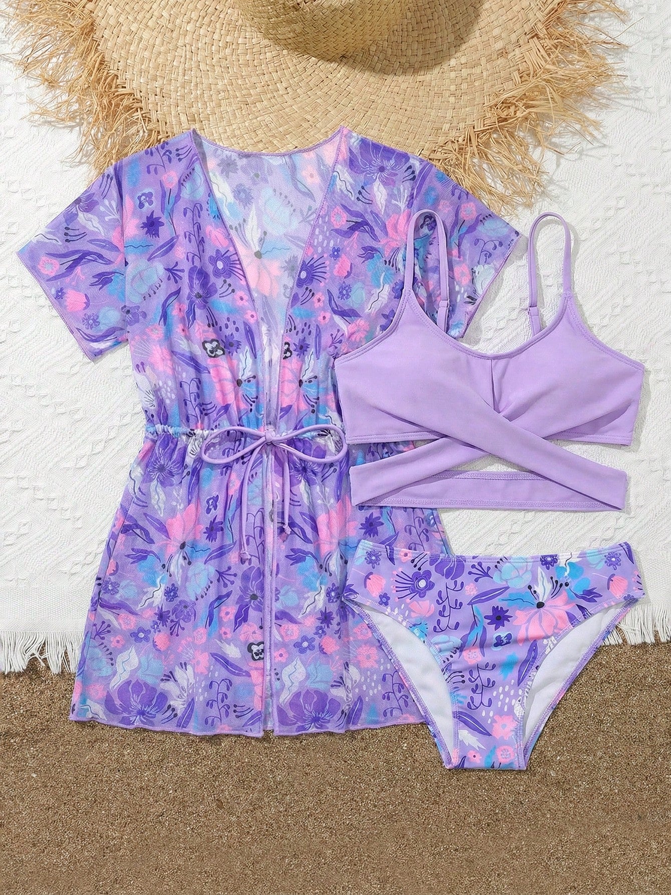 Three-piece tween girls swimwear set with a floral print, featuring a criss-cross bikini top, regular bikini bottoms, and a kimono cover-up in assorted prints.