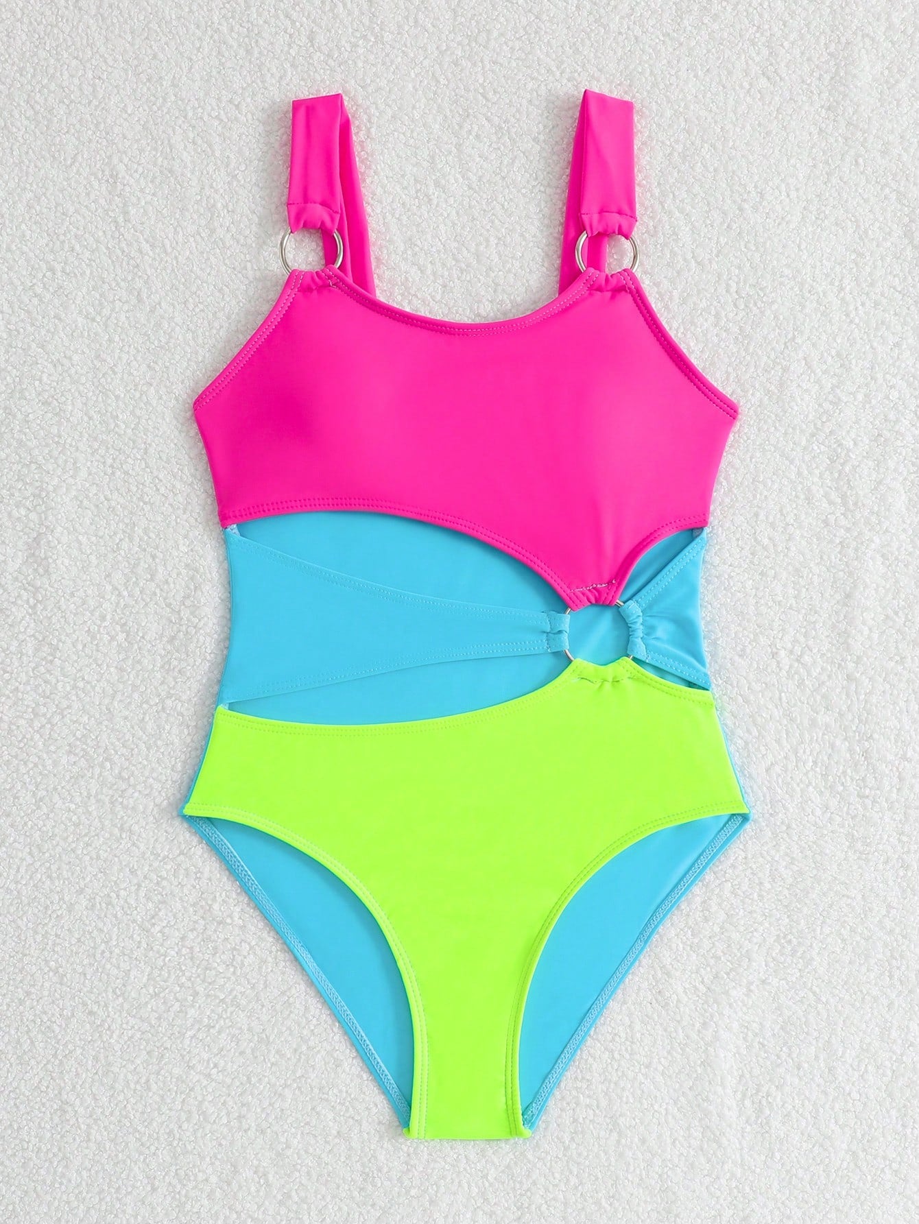 Black one-piece swimsuit for tween girls with cut out detail, spaghetti straps, high waist bottom, wireless bra, and fitted vacation swimwear style.
