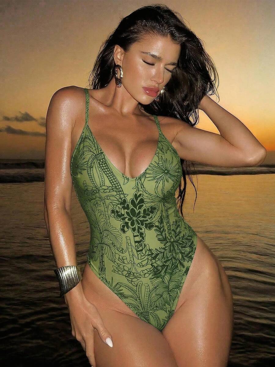 Women's black lace one-piece swimsuit featuring a deep V-neckline, spaghetti straps, backless tie-up detail, and thong bottom.