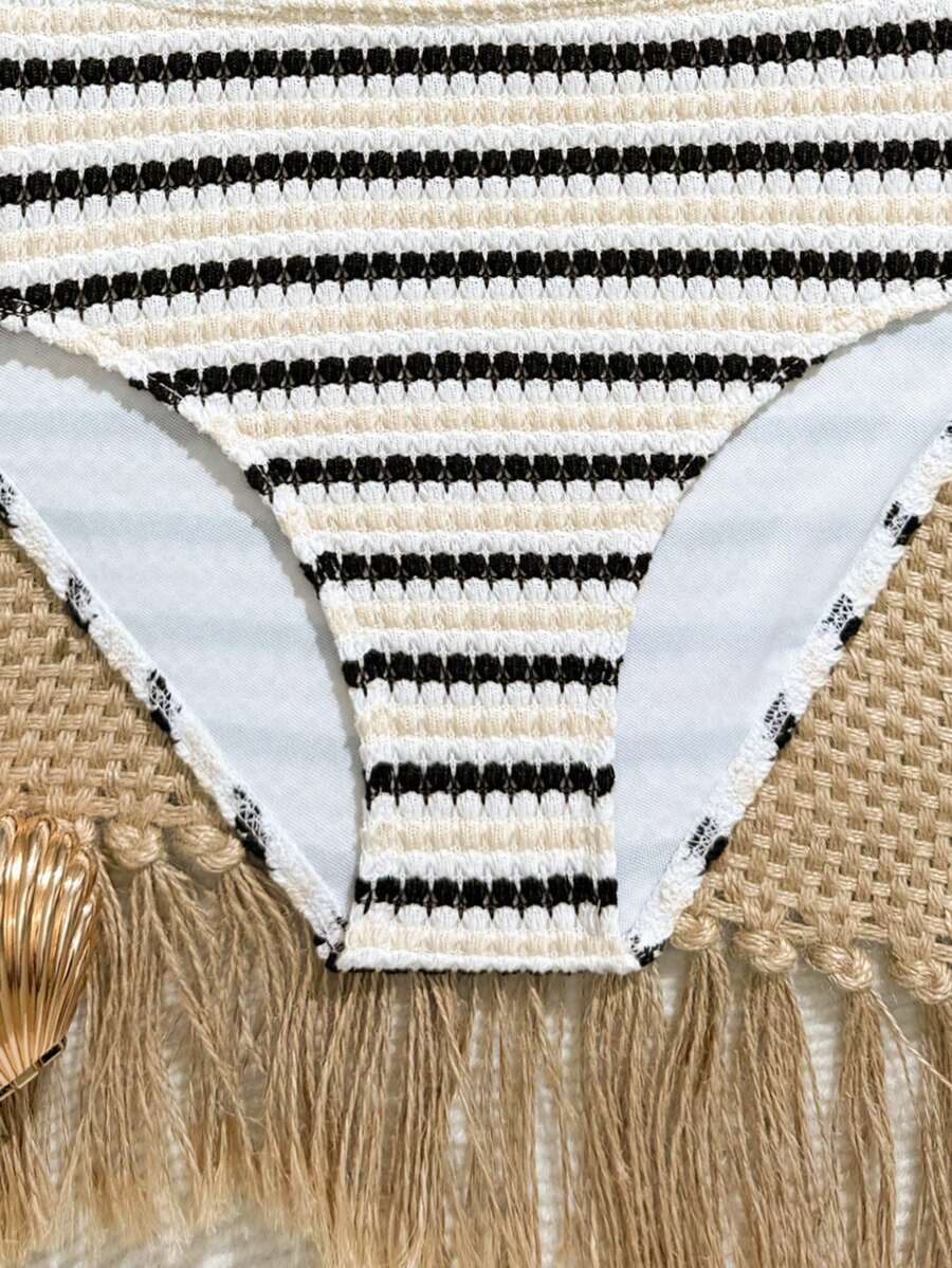 Tween girls pink and white striped two-piece bikini set with spaghetti strap bandeau top, starfish decor, and high waist swim bottoms for beach and vacation wear