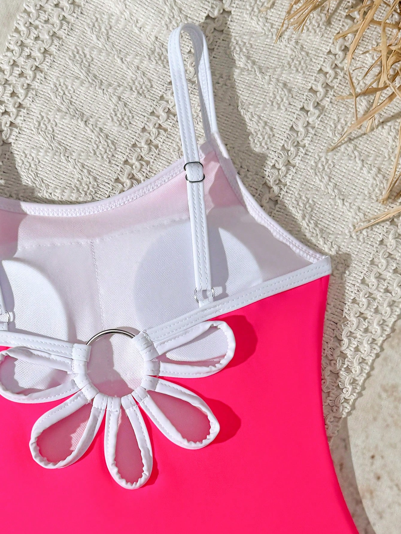 Tween girls one-piece swimsuit with a floral plant print, spaghetti straps, and a mid-waist fit in black.