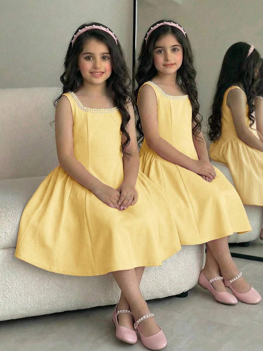 Sleeveless pink square neck A-line dress for tween girls featuring pearl embellishments and a high-waist slim fit design.