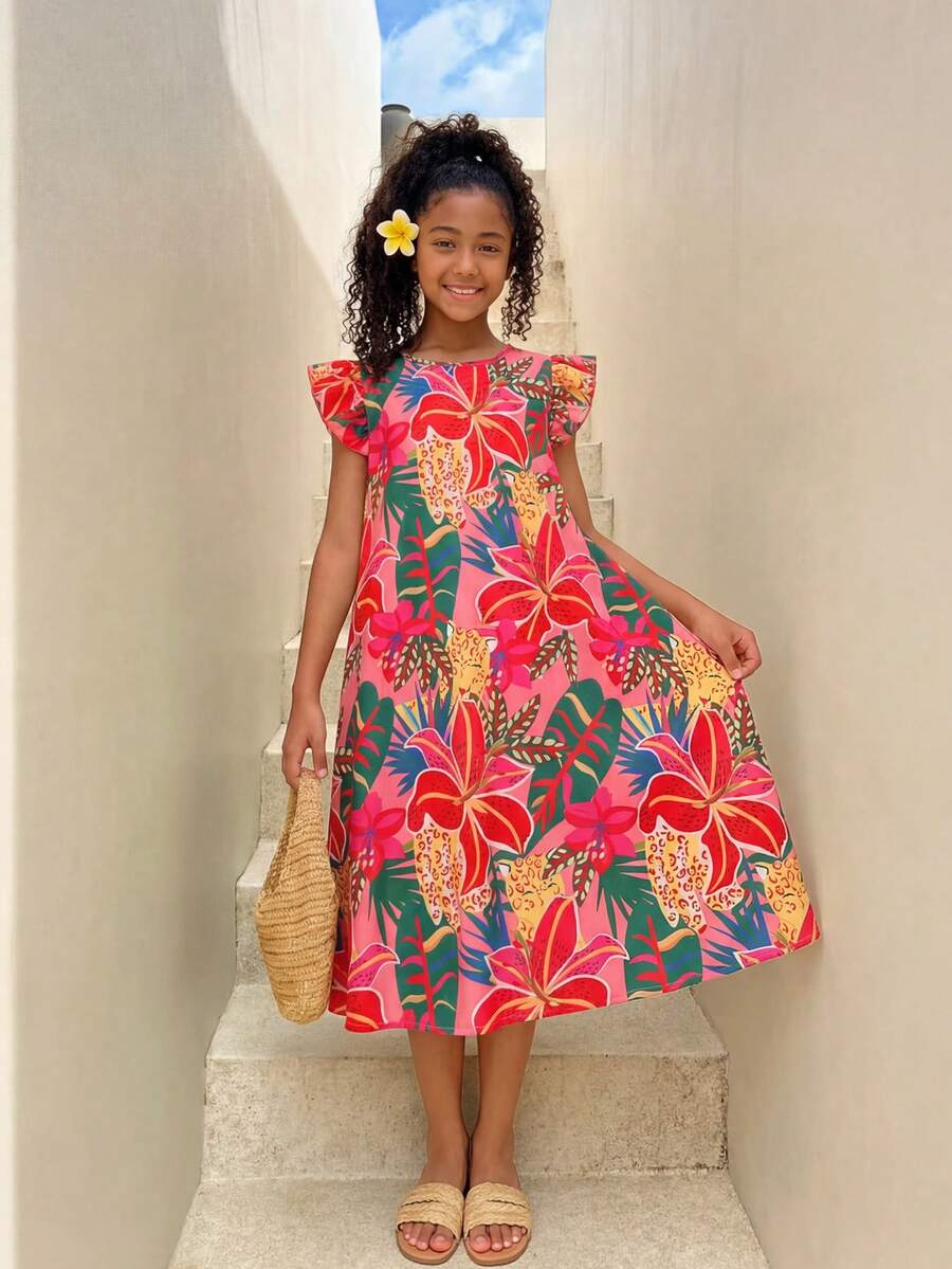 Tween girls sleeveless tropical floral mini dress in black with round neck and ruffle hem detail